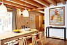 Dining area with kitchen behind